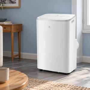 Climatiseur mobile Electrolux EXP26U339AW blanc aux angles arrondis dans une pièce.